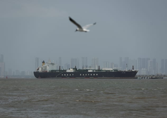 A bird flies near the Jag Vasant vessel transferring LPG at a port after transiting the Strait of Hormuz amid supply disruptions linked to the U.S-Israeli conflict with Iran, in Mumbai, India, April 1, 2026. 