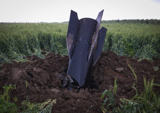 A fragment of a missile fired from Iran toward Israel, intercepted by Israeli air defense systems, seen lodged in the ground in the Golan Heights, April 7, 2026.