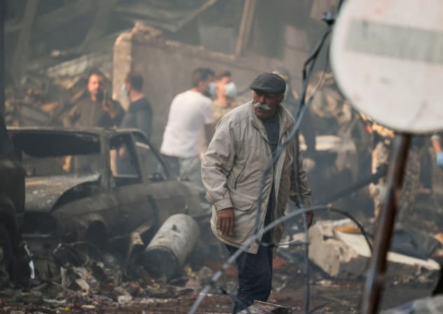 A man walks at the site of an Israeli strike, in Al-Mazraa in Beirut, Lebanon, April 8, 2026.