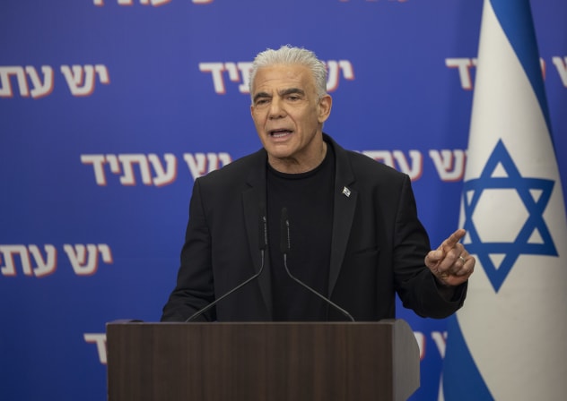 Head of the opposition and head of the Yesh Atid party MK Yair Lapid and MK Meirav Ben-Ari deliver a joint statement at the Knesset, the Israeli parliament in Jerusalem, March 30, 2026.