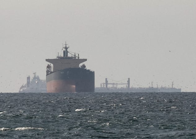 Cargo ships in the Gulf, near the Strait of Hormuz, as seen from northern Ras al-Khaimah, near the border with Oman’s Musandam governance, amid the US-Israeli conflict with Iran, in United Arab Emirates, March 11, 2026.