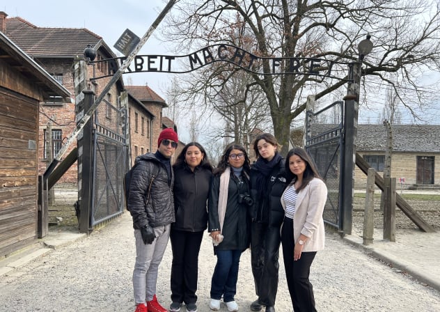 THE WRITER (R) is seen alongside members of Fuente Latina’s Student Media Fellowship Program on a trip to Auschwitz.