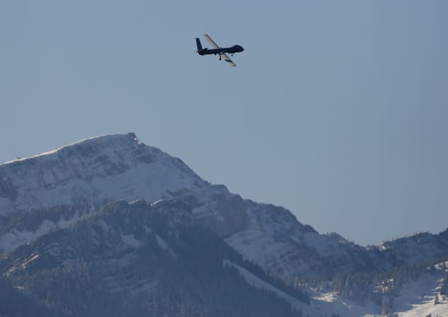 The Israeli Elbit Systems Ltd. Hermes 900 unmanned aerial vehicle (UAV) flies over the airbase during a media presentation in the central Swiss town of Emmen 