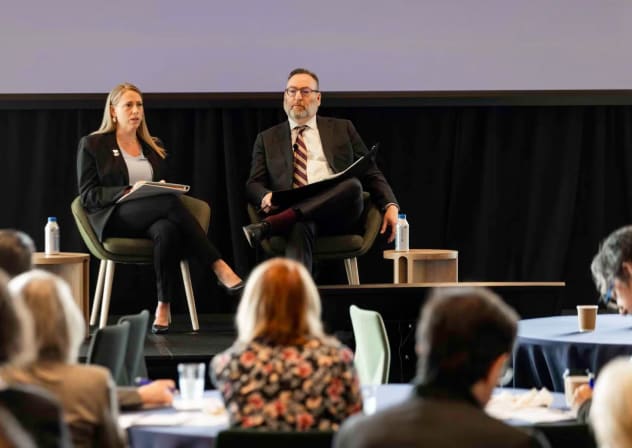 (L-r) Andrea Lucas, chair of the federal Equal Employment Opportunity Commission, speaks with Brandeis Center founder Kenneth Marcus at an antisemitism conference held at Harvard University in Cambridge, Massachusetts, April 16, 2026.
