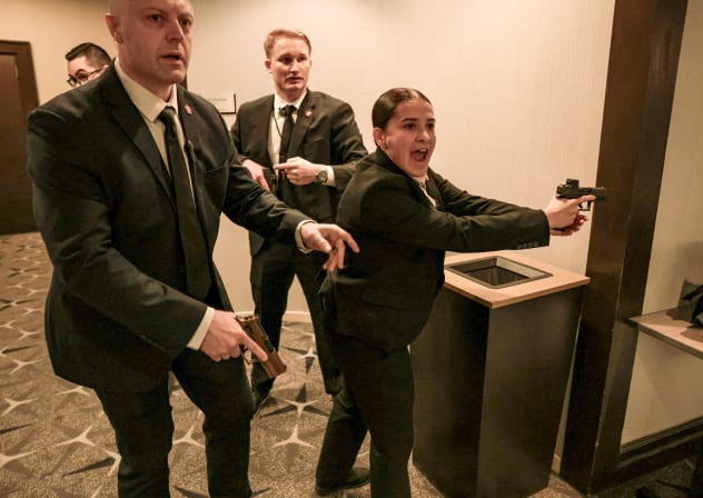 Security officials react as a shooter opens fire during the annual White House Correspondents' Association dinner in Washington, DC, US, April 25, 2026.