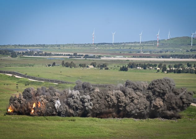 Smoke and fire rise from a controlled landmine explosion in northern Golan Heights, on the Syrian border, April 17, 2024; illustrative.