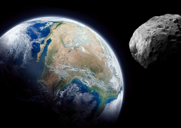 Imagen ilustrativa de un asteroide cerca de la Tierra.
