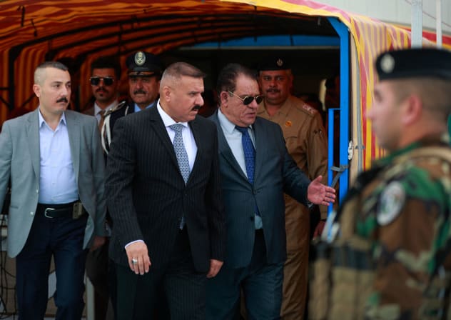 Iraqi Interior Minister Abdul Amir al-Shammari (C) arrives at the police club stadium in Baghdad on June 5, 2023, during the annual sports festival of the Iraqi Ministry of Interior.