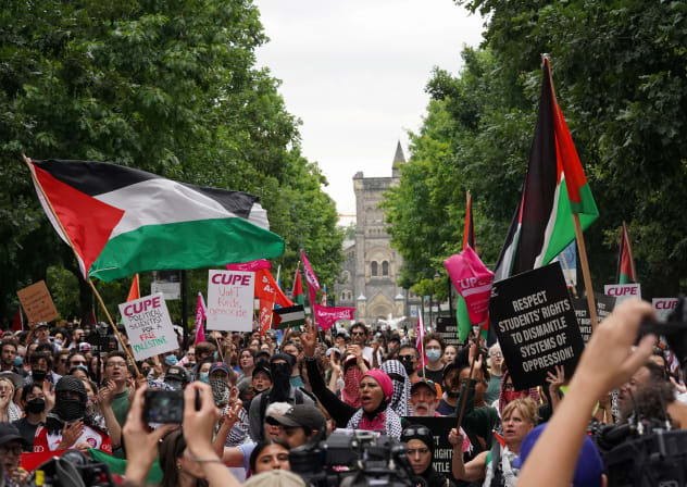 Protesters march out of Kings College Circle after leaving a pro-Palestinian student encampment at the University of Toronto following an Ontario judge order for pro-Palestinian protesters to leave their two-month-old encampment, amid the ongoing conflict between Israel and Hamas, in Toronto