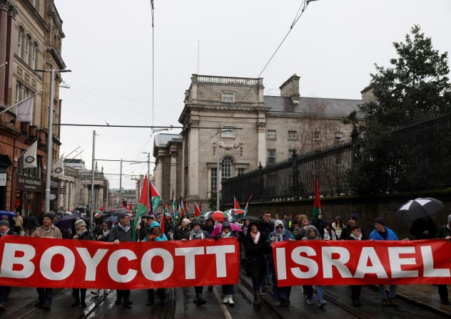 (ILLUSTRATIVE) DEMONSTRATORS HOLD banners in support of Palestinians during a protest in relation to the ceasefire in Gaza, in Dublin, Ireland, February 21, 2026.