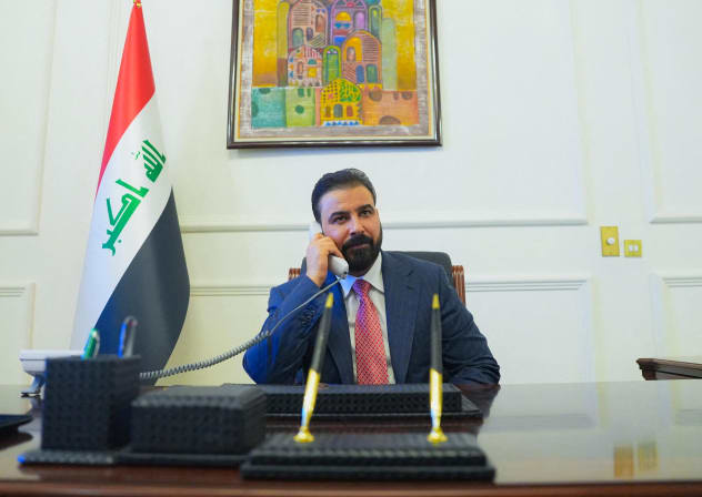 New Iraqi Prime Minister designate Ali al-Zaidi, uses a phone at his office in Baghdad, Iraq, April 28, 2026.