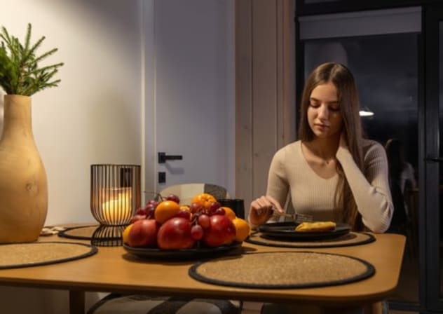 A woman having a late dinner