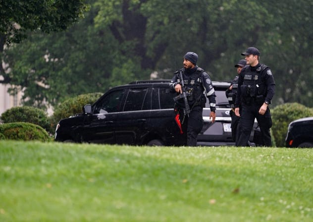 US SECRET Service agents walk at the White House after alleged gunshots were heard nearby, in Washington, DC, US, May 23, 2026.