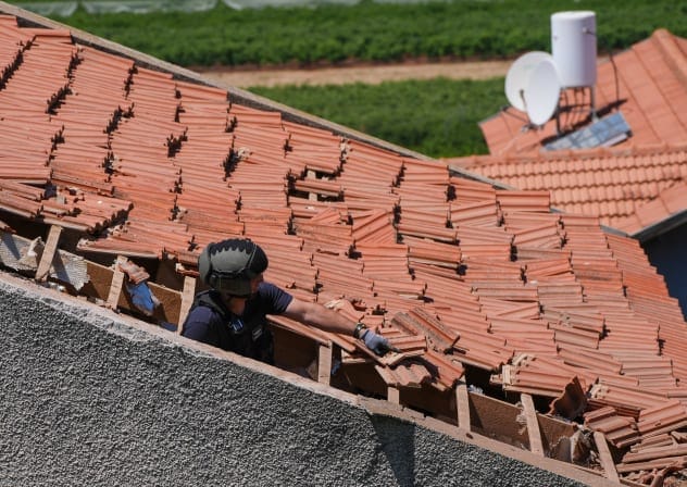 Israeli security forces at the scene where a house was hit by an explosive drone launched by Hezbollah from Lebanon in Metula near the Israeli-Lebanese border, May 25, 2026.