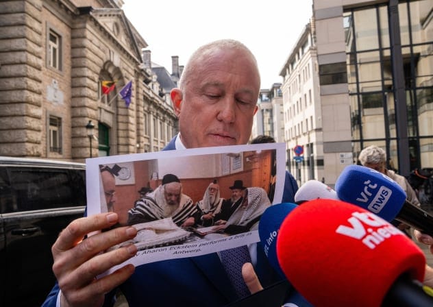 US AMBASSADOR to Belgium Bill White shows an image of a ritual circumcision, in Brussels.