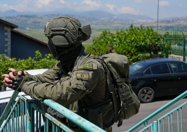 Israeli security forces at the scene where a house was hit by an explosive drone launched by Hezbollah from Lebanon in Metula near the Israeli-Lebanese border, May 25, 2026.