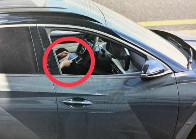 A driver caught using their cellphone while driving during Israel Police’s enforcement campaign aimed at cracking down on traffic offenses across Israel.