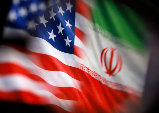 US and Iranian flags are seen in this illustration taken March 23, 2026. 