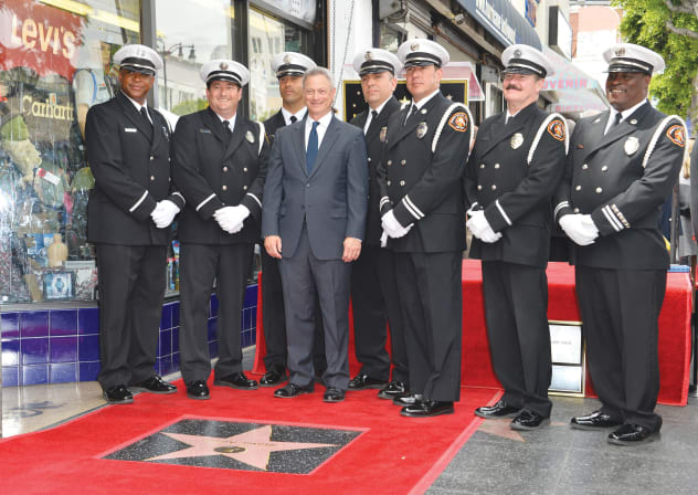 Gary Sinise receives a star on the Hollywood Walk of Fame, surrounded by armed guard, 2017.