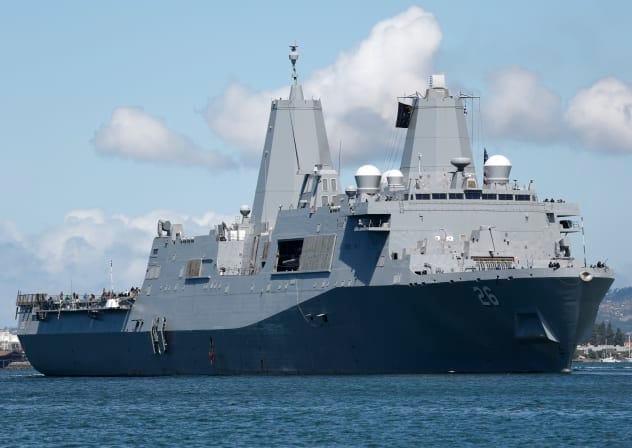 he U.S. Navy amphibious transport dock ship USS John P. Murtha sails through San Diego Bay en route to Naval Base San Diego with the Artemis II mission Orion spacecraft onboard on April 11, 2026 in San Diego, California.