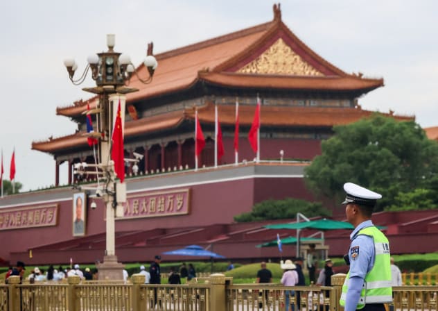 A police officer guards next to the Tiananmen Gate in Beijing, China, June 4, 2026. 