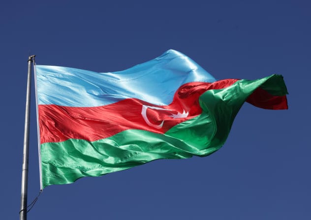 The Azerbaijani flag flies in the city center one day before the opening of the UNFCCC COP29 Climate Conference on November 10, 2024 in Baku, Azerbaijan.