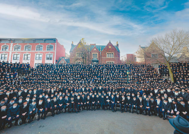 CHABAD ‘SHLUCHIM’ gather in front of 770 Eastern Parkway, New York, in 2022.