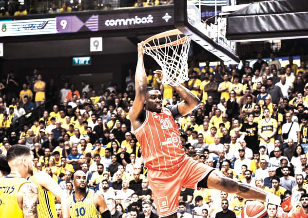 TAI ODIASE dunks for two of his 12 points in Hapoel Tel Aviv’s series-saving 80-74 Game 3 victory over Maccabi Tel Aviv.