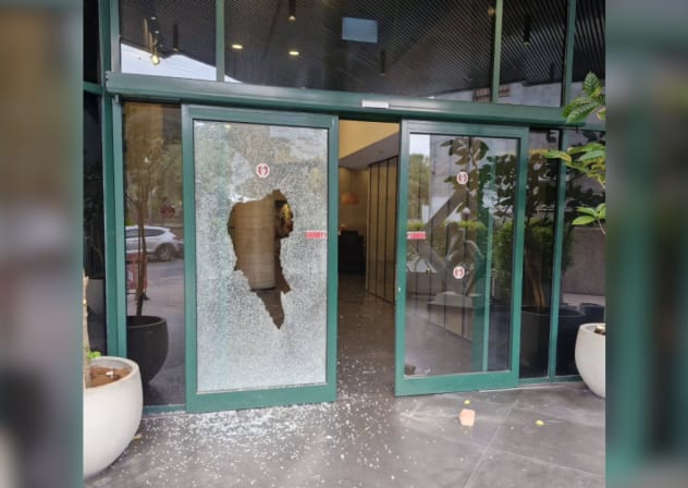 Front door of Channel 12 News offices shattered by vandals in Tel Aviv, July 5, 2026.