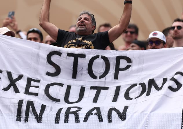 Fans holds the banner reading 'Stop Execution in Iran' before the FIFA World Cup 2026 Group G match between Belgium and IR Iran at Los Angeles Stadium on June 21, 2026.