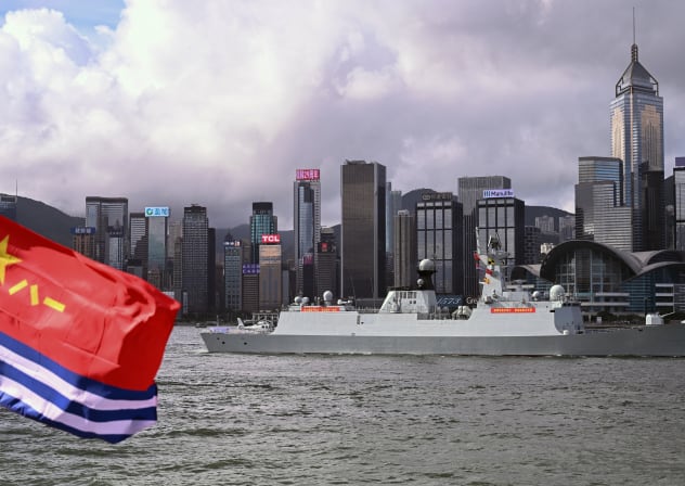 The Chinese People's Liberation Army (PLA) Navy frigate Hengyang (568) is seen past a PLA Navy ensign as it sails through Victoria Harbour during its arrival in Hong Kong for a five-day visit on July 2, 2026.