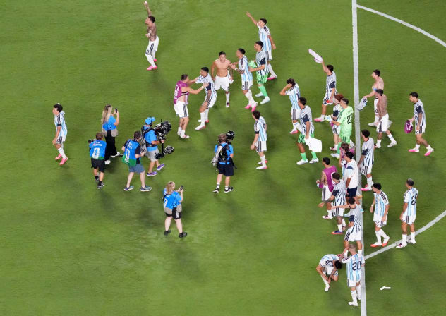 Argentina players celebrate after the match as Argentina qualify for the semi finals of the World Cup.