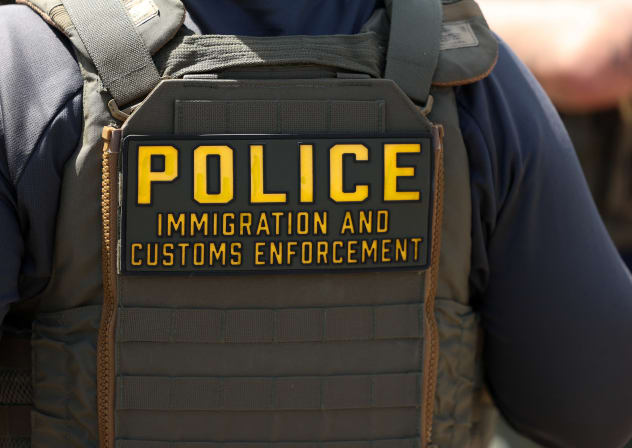 An Immigration and Customs Enforcement (ICE) agent stands near Delaney Hall which is being used as an Immigration and Customs Enforcement detention center on in Newark, New Jersey, on May 26, 2026.