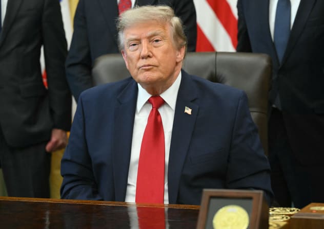 US President Donald Trump looks on after signing an executive order to drastically shrink two national monuments in Utah, paving the way for fossil fuel extraction and mining, at the Oval Office of the White House in Washington, DC, on July 13, 2026.