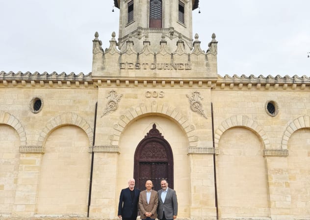 PAGODA TURRETS of Chateau Cos d’Estournel: The writer (L) with Menachem Israelievitch and Olivier Cuvelier.