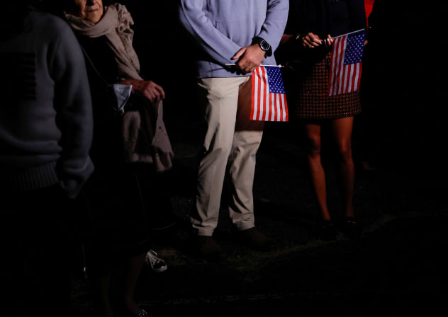 Family members with US flags wait to greet freed American detainees released in a prisoner swap deal between U.S and Iran upon arriving at Davison Army Airfield at Fort Belvoir, Virginia, US, September 19, 2023.