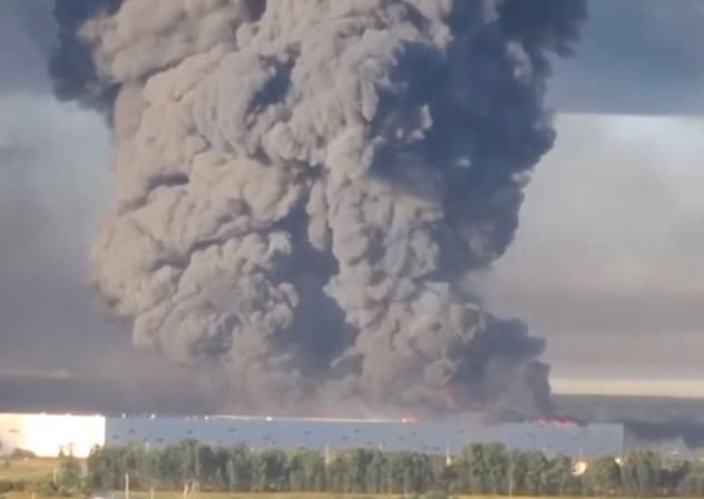 Smoke billows from a warehouse, after deadly Ukrainian drone attacks, as per regional governors, in Elektrostal, Moscow Region, Russia, July 18, 2026, in this screen grab obtained from a social media video. 