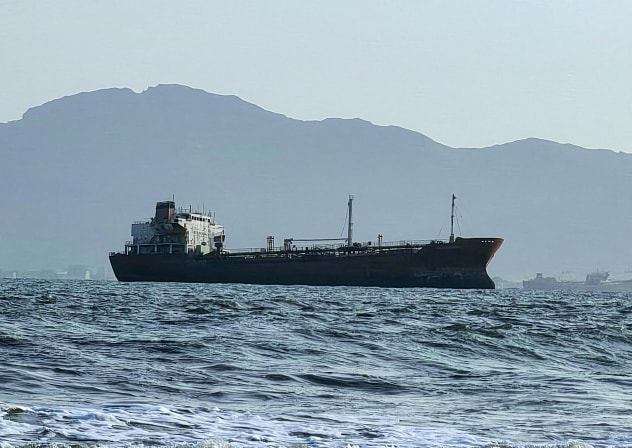 A ship off the port of Aden, where traffic remained steady after the Iran-aligned Houthis said their forces had carried out missile and drone strikes on Saudi oil tankers, in Aden, Yemen, July 23, 2026. 