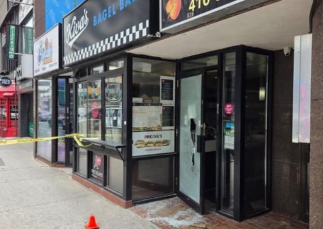 Shattered windows at Kiva’s Bagel Bar after suspected antisemitic attack in Toronto, Canada. July 26, 2026.