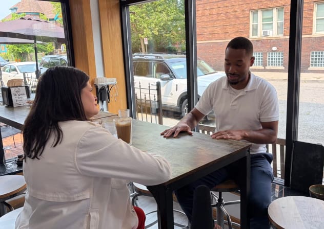 US Rep. Haley Stevens (l), candidate for the Democratic Senate nomination in Michigan, discusses Israel with Jai Singletary, director of a Detroit neighborhood improvement association, in Detroit, Michigan, July 27, 2026.