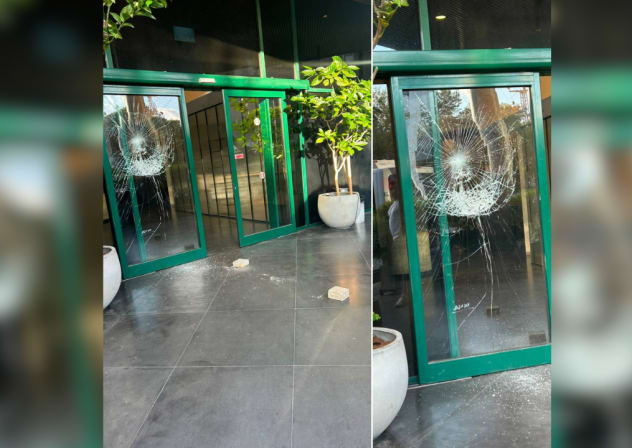 A masked individual shattered the glass entrance doors of Channel 12 News' headquarters in Tel Aviv overnight on July 28, 2026, in the second such incident this month.