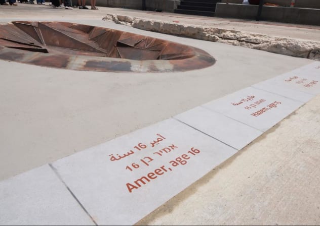 Memorial at Majdal Shams listing the victims of the rocket strike there.