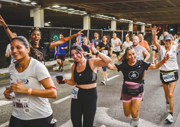 THOUSANDS OF RUNNERS take part in the Tel Aviv Night Run, Oct. 2025.
