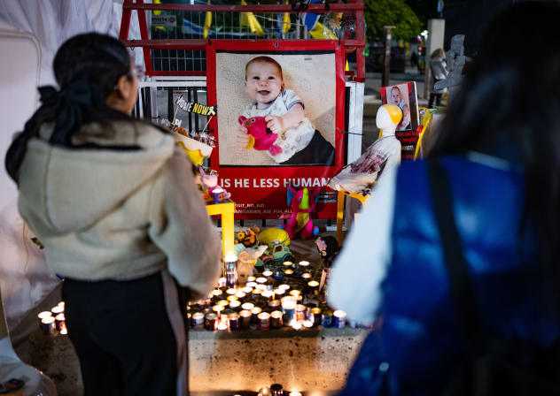 Candles are lit in memory of late Israeli hostages Shiri Bibas and her children Ariel and Kfir at Hostage Square in Tel Aviv, February 26, 2025