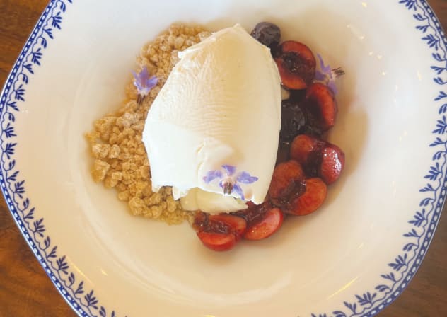 PistVanilla ice cream with cherries and 'edible' flowers.