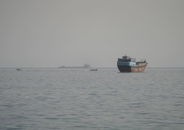 Vessels in the Strait of Hormuz, as seen from Musandam, Oman, August 3, 2026. 