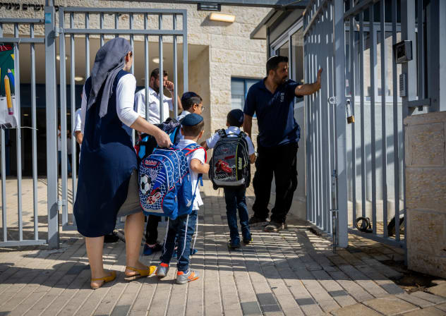 Young students arrive to the classroom at the opening of the new school year in a school for ultra orthodox jewish boys, in Beit Shemesh, August 28, 2022. 