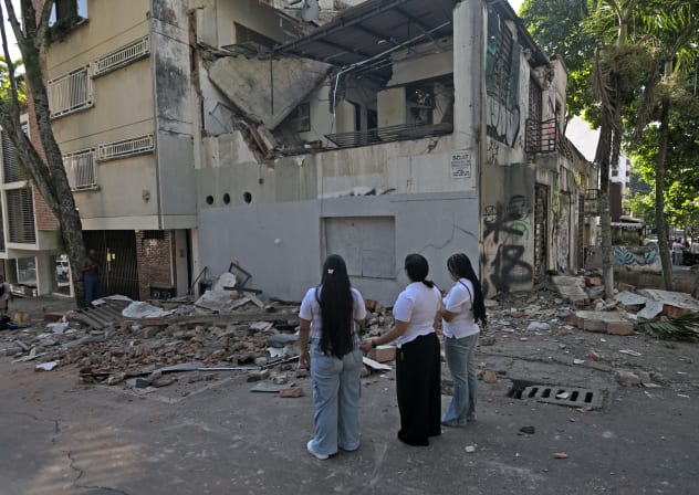 Women look at a damaged building after an earthquake in Cali, Colombia on August 10, 2026.