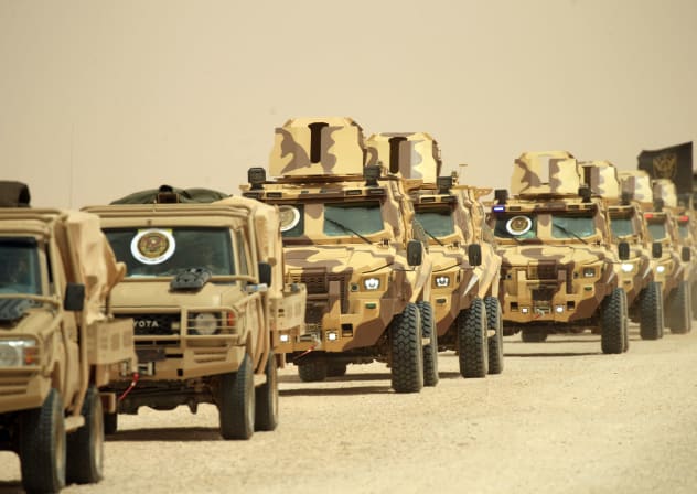 Libyan army vehicles take part in the "Dara' al-Karama 2" military exercises, conducted by the Libyan National Army (LNA), under the command of Field Marshal Khalifa Haftar, in the Ras al-Alba region in southeastern Libya on May 16, 2026. 