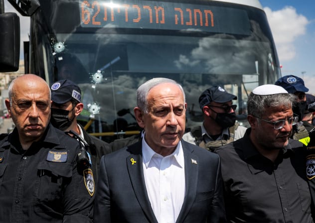 Israel’s Prime Minister Benjamin Netanyahu (C) and National Security Minister Itamar Ben-Gvir (R) visit the scene of a shooting at the Ramot road junction in Israeli-annexed east Jerusalem on September 8, 2025. 
